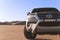 Toyota  Fortuner standing in the middle of the Namib desert on a sunny day.