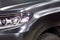 The Toyota Land Cruiser car covered with a protective paint and varnish matte film of black color is in the repair shop. PPF