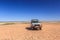 Toyota Landcruiser all terrain car on a red gravel plain in the Simpson Desert in Australia