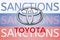 Toyota logo in front of the sanction text on the Russian flag. Fresh sanctions against Russia over its invasion of