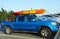 Toyota Tacoma SUV loaded with kayak and bicycles