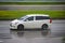 Toyota Wish on wet road in a rainy day.