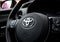 Toyota Yaris Hybrid car. Steering wheel with logo