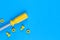 Toys background. Kids construction toys tools on light blue and yellow background.