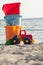 Toys children for the beach on the sand. Sea and sky in the background