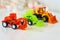 Toys green loader, red blured excavator and orange blured loader