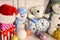 Toys placed on wooden wall background. Snowmen and teddy bears
