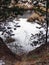 Traces of shoes in the snow in the forest.