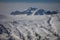 Traces of skiers and snowboarders on white snowy meadows of Fedare, Dolomites