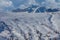 Traces of skiers and snowboarders on white snowy meadows of Fedare, Dolomites