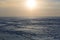 Traces of skis and snowmobiles on the surface of a winter lake