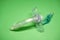 Tracheostomy tube on a green background