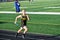 Track and Field Athlete Running Relay