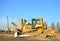 Track-type bulldozer, earth-moving equipment. Land clearing, grading, pool excavation, utility trenching, utility trenching