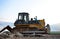 Track-type bulldozer, earth-moving equipment. Land clearing, grading, pool excavation, utility trenching, utility trenching and