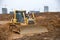 Track-type dozer for pool excavation and utility trenching. Bulldozer during land clearing and foundation digging. Earth-moving