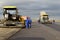 Tracked pavers laying fresh asphalt pavement on a runway as part of the Danube Delta international airport expansion plan