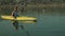 Tracking close up on kayaker enjoyin kayaking in lake