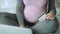 Tracking right video of unrecognizable pregnant woman with credit card