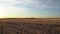 Tracking rise over a barbed wire fence on the Canadian prairies at sunrise