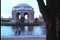 Tracking shot of people in front of Palace of Fine Arts