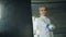 Tracking shot of Young concentrated fencer woman training fencing exercise in studio indoors