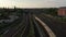 Tracking view of S bahn train arriving into station under Bosebrucke bridge. Aerial view of multi track railway line