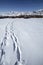 Tracks in a beautiful winter snowy rocky mountain landscape