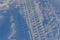 Tracks from car wheels on white loose snow. Pattern from the tread on the tires of the SUV. Off-road in winter. Image for