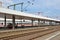 Tracks and platforms of Mannheim main train station with German `IC Intercity` train passing through