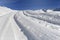 Tracks on a road covering with fresh snow