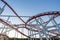 Tracks of Roller coaster against blue sky, Perspective Concept