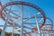 Tracks of Roller coaster against blue sky, Perspective Concept