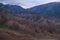 Tract Zhaman uy in the mountains of Kazakhstan on platey Assy. Fantastic clay remains of red color on summer evening