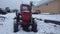 Tractor in agriculture and farming in winter