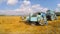 Tractor Baler Making Fresh Bale During Harvesting