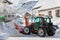 Tractor blower cleaning snow in street