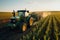 A tractor on a bountiful crop field, highlighting the essential role of agricultural machinery