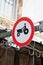 Tractor caution and warning sign, transportation sign with tractor symbol on metal and wires background