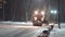 Tractor cleaning snow in the night city