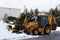 the tractor cleans the street from snow