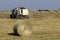 Tractor collecting haystack