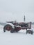 Tractor covered in snow