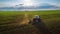 Tractor cultivating field at spring