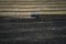 Tractor cultivating field at spring, aerial view