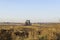 Tractor cultivating wheat stubble field with crop residue