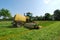 Tractor cutting grass meadow