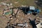 Tractor disassembles the rubble after the destruction of the house