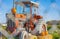 A tractor displays an autumn bounty in farm. A tractor decorated with hay and pumpkins for Thanksgiving and Halloween