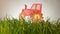 Tractor drawn icon on Grass green summer background.